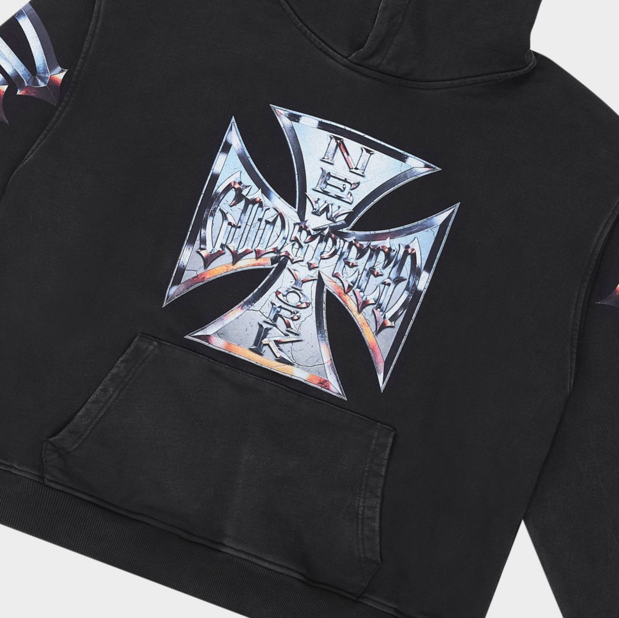 Black hoodie with a metallic cross design on a black background